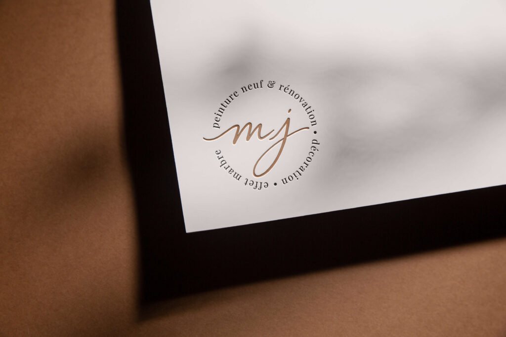 logo rond mj peintures doré sur fond blanc